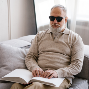Blind man holding a book
